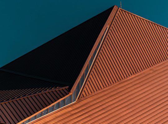 brown concrete building under blue sky during daytime